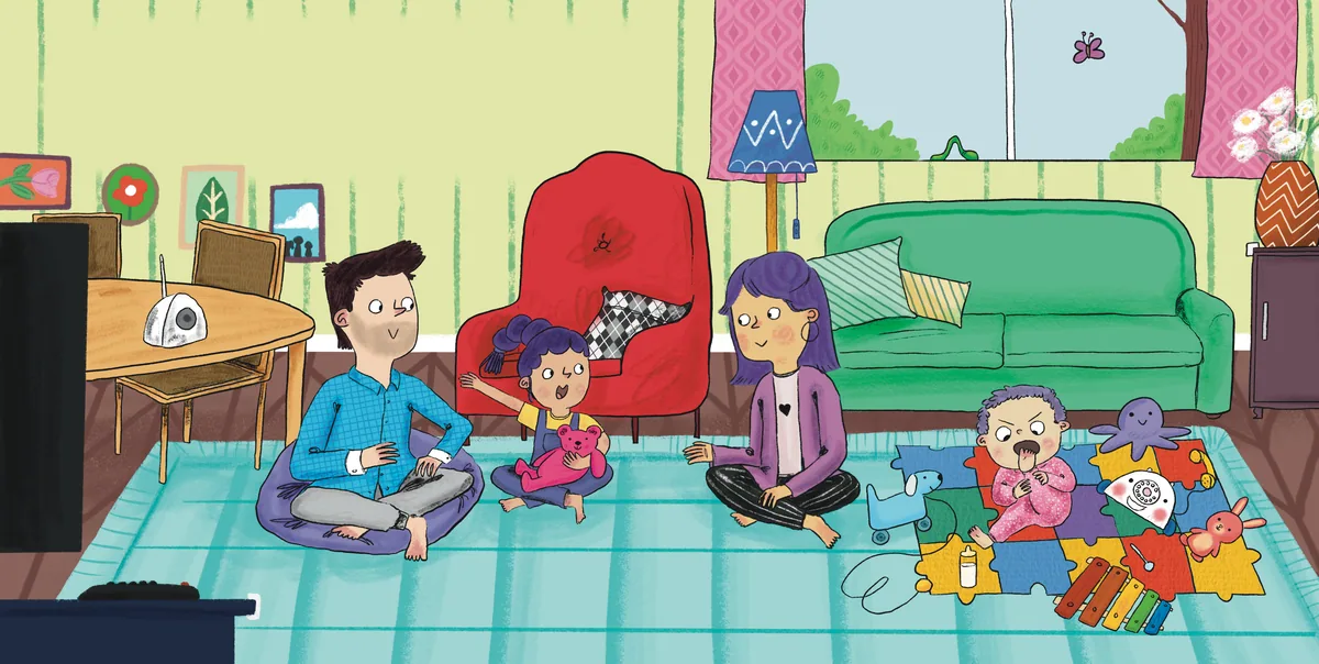 A family gathers with children and toys in a colourful living room.
