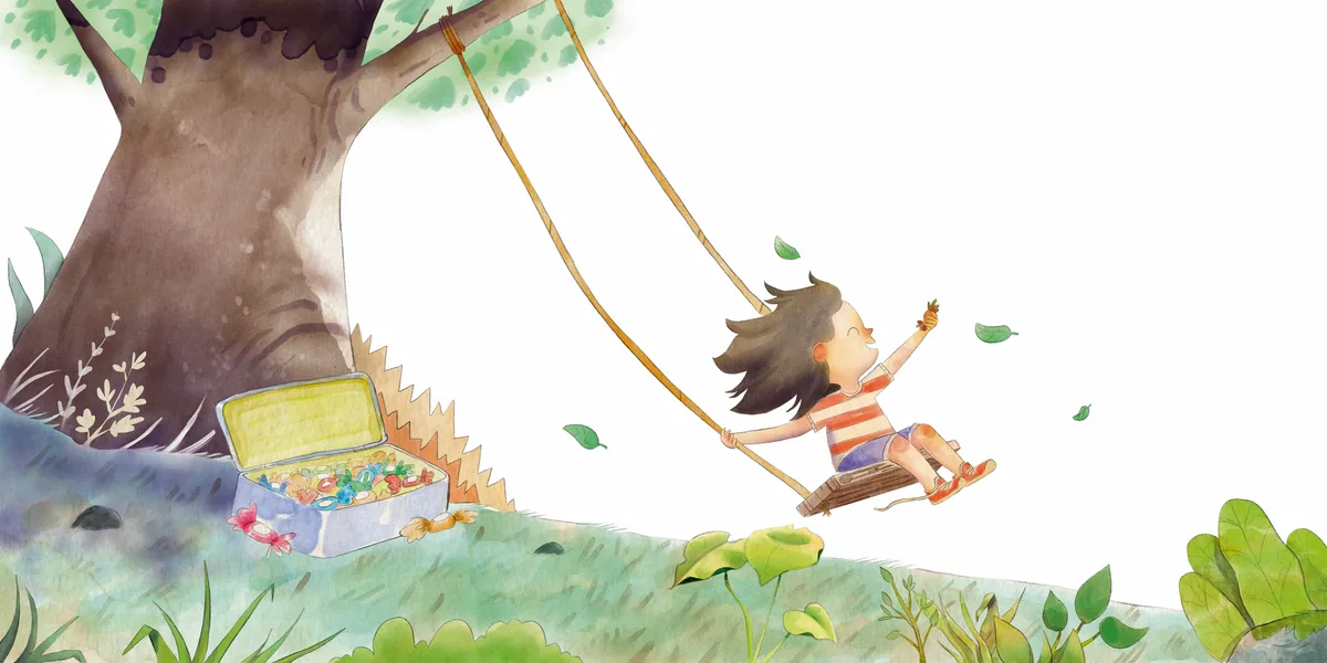 A child plays on a swing hanging from a tree, beside a box of keepsakes.